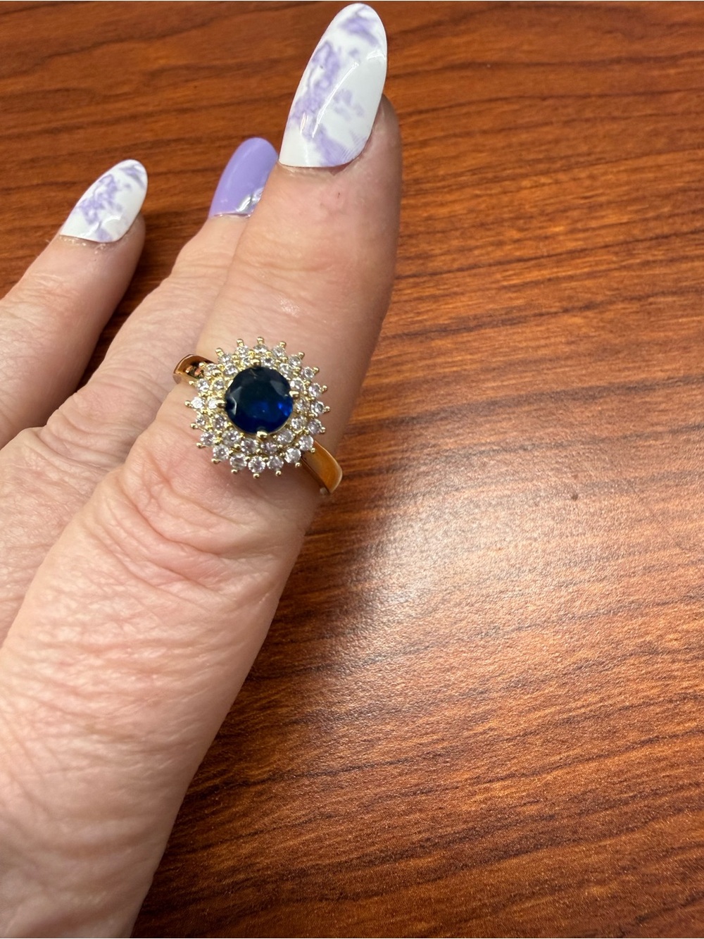 Pretty Bird Gold Ring with Deep Blue Center and Clear Halo Accent
